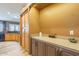 Hallway includes built in cabinets, a countertop, and a doorway view of the kitchen at 3948 E Vallejo Dr, Gilbert, AZ 85298