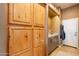 Hallway includes built in cabinets, a countertop, and a doorway view to the garage at 3948 E Vallejo Dr, Gilbert, AZ 85298