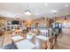 Bright, open living space flows into the kitchen, has wood-look tile, and natural lighting at 3948 E Vallejo Dr, Gilbert, AZ 85298