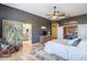 Spacious primary bedroom featuring elegant decor and seamlessly connects to the en-suite bathroom and kitchen at 3948 E Vallejo Dr, Gilbert, AZ 85298