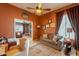 Comfortable home office space with wood-look floors and a view to the living area at 3948 E Vallejo Dr, Gilbert, AZ 85298