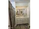 Bathroom featuring a double vanity, overhead lighting, and shower at 4065 E University Dr # 83, Mesa, AZ 85205
