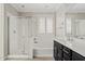 A modern bathroom with a tub, shower, and a window with bright shutters at 4197 E Rawhide St, Gilbert, AZ 85296