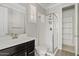 Modern bathroom with a glass-enclosed shower, stylish vanity, and a linen closet at 4197 E Rawhide St, Gilbert, AZ 85296
