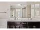 Bathroom featuring a double vanity and a large mirror at 4197 E Rawhide St, Gilbert, AZ 85296