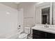 Bathroom featuring a shower-tub combination and a vanity with modern fixtures at 4197 E Rawhide St, Gilbert, AZ 85296