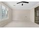 A very spacious bedroom with natural light, and neutral colors, features shutters at 4197 E Rawhide St, Gilbert, AZ 85296