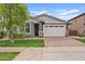 Charming single-story home with a two-car garage, neat landscaping, and a brick driveway at 4197 E Rawhide St, Gilbert, AZ 85296