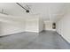 Spacious garage with epoxy flooring, water heater, and garage door opener at 4197 E Rawhide St, Gilbert, AZ 85296