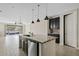Spacious kitchen features an island with a sink, stainless steel dishwasher, and pendant lighting at 4197 E Rawhide St, Gilbert, AZ 85296