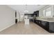 Kitchen features stainless steel appliances, granite countertops, dark wood cabinetry, and tile floors at 4197 E Rawhide St, Gilbert, AZ 85296