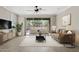 Bright living room with stylish furniture, recessed lights, and sliding glass doors to the patio at 4197 E Rawhide St, Gilbert, AZ 85296