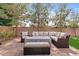 Inviting outdoor patio with comfortable wicker seating and a cozy fire pit, perfect for relaxing or entertaining guests at 4197 E Rawhide St, Gilbert, AZ 85296
