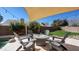 Beautiful backyard patio with a fire pit and adirondack chairs, perfect for entertaining at 4235 W Harrison St, Chandler, AZ 85226