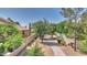 Private backyard with mature trees, walkway, and block wall at 4235 W Harrison St, Chandler, AZ 85226