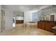 Elegant bathroom features a soaking tub, separate shower, dual sinks, and granite countertops for a luxurious feel at 4235 W Harrison St, Chandler, AZ 85226