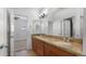 Bathroom featuring a double sink vanity with granite countertop and tile flooring at 4235 W Harrison St, Chandler, AZ 85226