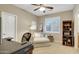 Bedroom featuring a ceiling fan, a lounge chair, neutral-toned walls, and carpeted floors at 4235 W Harrison St, Chandler, AZ 85226