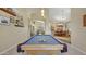 A bright, well-lit billiards room with a pool table in a spacious home at 4235 W Harrison St, Chandler, AZ 85226