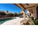 Relaxing covered patio with comfortable seating, a ceiling fan, and views of the pool at 4235 W Harrison St, Chandler, AZ 85226