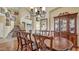 Elegant dining room with hardwood floors, an exquisite table set, and views to other spaces at 4235 W Harrison St, Chandler, AZ 85226