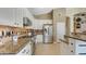 Kitchen featuring granite countertops, stainless steel appliances and light wood cabinets at 4235 W Harrison St, Chandler, AZ 85226