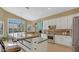 Kitchen area featuring a large island with seating, stainless appliances, and breakfast nook at 4235 W Harrison St, Chandler, AZ 85226