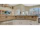 Kitchen featuring stone countertops, stainless steel appliances and an arched window at 4235 W Harrison St, Chandler, AZ 85226