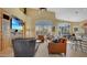 Open-concept living room with high ceilings, plantation shutters, and direct access to the kitchen at 4235 W Harrison St, Chandler, AZ 85226