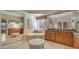 Main bathroom features double sink vanity, standalone tub, and walk-in mirrored closet at 4235 W Harrison St, Chandler, AZ 85226
