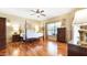 Spacious main bedroom with hardwood floors, ceiling fan, and a four-poster bed at 4235 W Harrison St, Chandler, AZ 85226