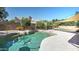 A beautiful backyard swimming pool with mature landscaping, flagstone deck and privacy fence at 4235 W Harrison St, Chandler, AZ 85226