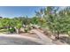 Inviting walking path lined with trees, leading to a scenic community area with a bench for relaxing and enjoying the view at 4235 W Harrison St, Chandler, AZ 85226