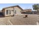 Low maintenance backyard featuring gravel, desert landscaping, and block wall, offering a private outdoor space at 43815 W Cahill Dr, Maricopa, AZ 85138