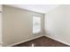 Empty bedroom featuring neutral walls, carpet floors, and a window with natural light at 43815 W Cahill Dr, Maricopa, AZ 85138