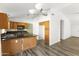 Bright kitchen featuring modern appliances, an island, and ample cabinet space at 43815 W Cahill Dr, Maricopa, AZ 85138