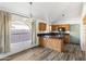 Bright kitchen featuring modern appliances, an island, and ample cabinet space at 43815 W Cahill Dr, Maricopa, AZ 85138