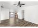 Bright, open living room featuring stylish flooring and neutral walls at 43815 W Cahill Dr, Maricopa, AZ 85138