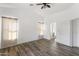 Bright main bedroom featuring stylish flooring, neutral walls, and ample natural light at 43815 W Cahill Dr, Maricopa, AZ 85138