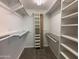 Walk-in closet featuring ample shelving and storage space at 4615 E Emerald Ave, Mesa, AZ 85206