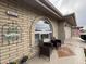 Cozy front entrance with brick facade, arched window, seating, and a 'Welcome' sign at 4615 E Emerald Ave, Mesa, AZ 85206