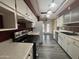 Spacious kitchen featuring stainless steel appliances, hardwood floors, and access to the outdoor patio at 4615 E Emerald Ave, Mesa, AZ 85206