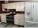 Bright kitchen featuring stainless steel appliances, white cabinets, and laminate countertops at 4615 E Emerald Ave, Mesa, AZ 85206
