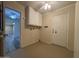 Interior laundry room with washer hookups and utility door at 4615 E Emerald Ave, Mesa, AZ 85206