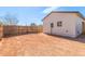 Backyard featuring a newly-installed wooden fence, stucco wall, and dirt at 463 W Taylor Ave, Coolidge, AZ 85128