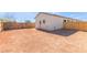 Backyard featuring a newly-installed wooden fence, stucco wall, and dirt at 463 W Taylor Ave, Coolidge, AZ 85128