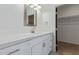 Modern bathroom vanity with white cabinets, quartz countertops and a framed mirror at 463 W Taylor Ave, Coolidge, AZ 85128