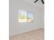 Light-filled bedroom with a window and wood-look flooring offers serene ambiance at 463 W Taylor Ave, Coolidge, AZ 85128