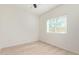 Well-lit bedroom with a large window, wood-look floors, and neutral decor at 463 W Taylor Ave, Coolidge, AZ 85128