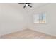 Well-lit bedroom with a ceiling fan and window, showcasing a comfortable and airy space at 463 W Taylor Ave, Coolidge, AZ 85128